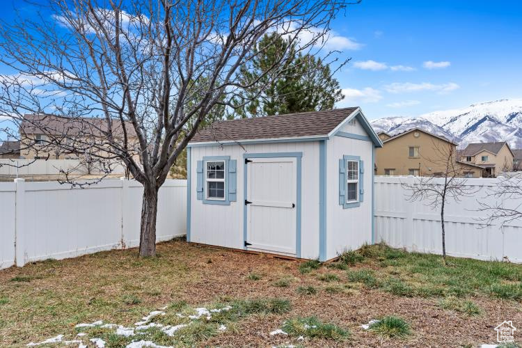 View of shed with a mountain view