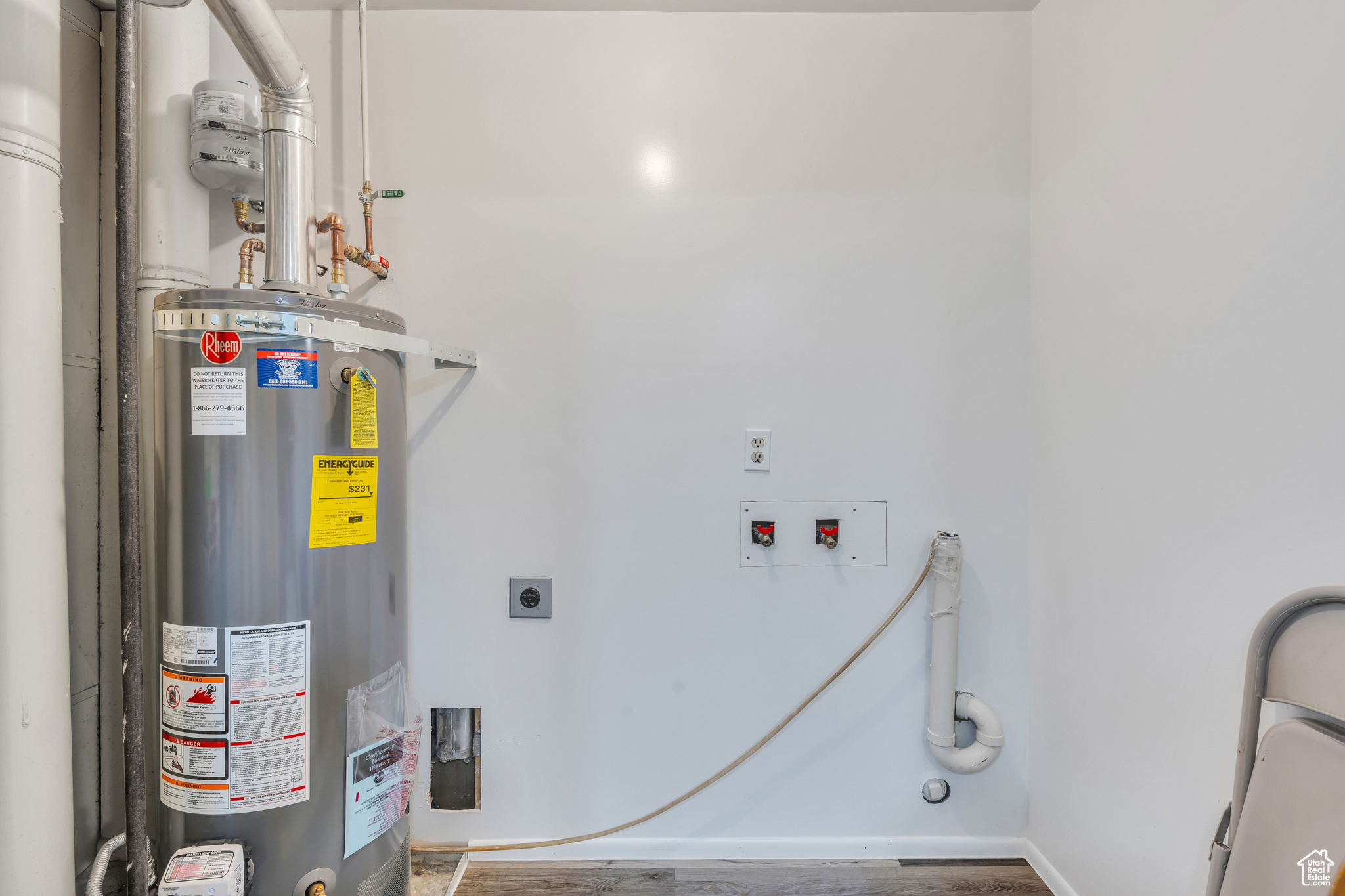 Utility room featuring gas water heater