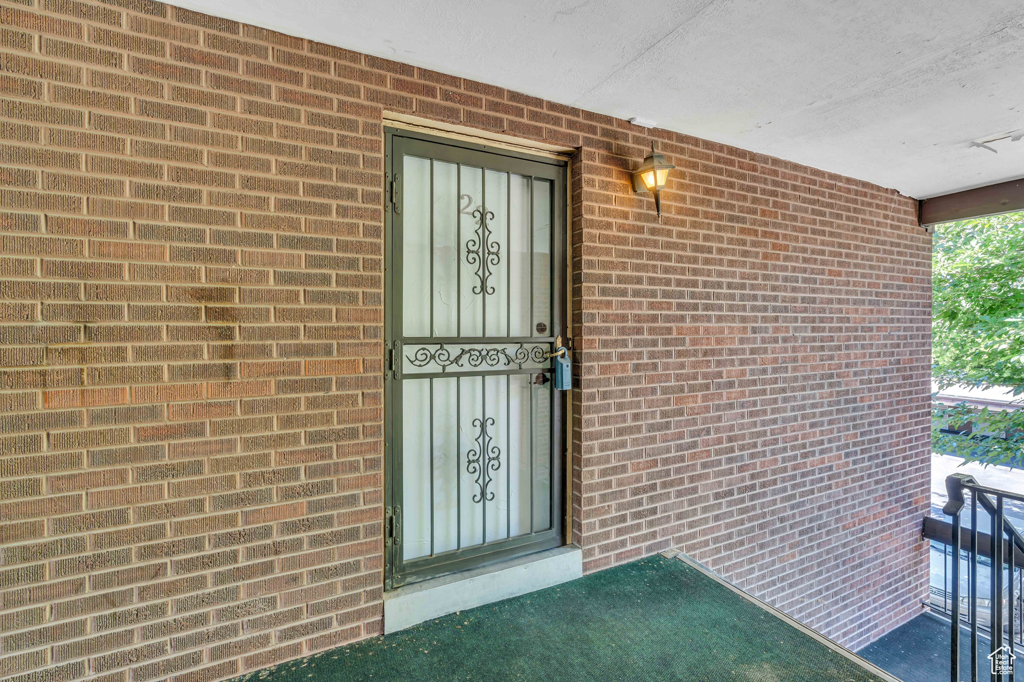 Property entrance featuring a balcony