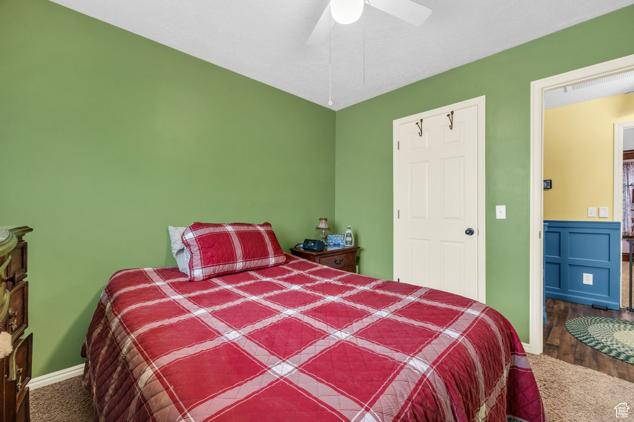 Bedroom featuring carpet floors and ceiling fan