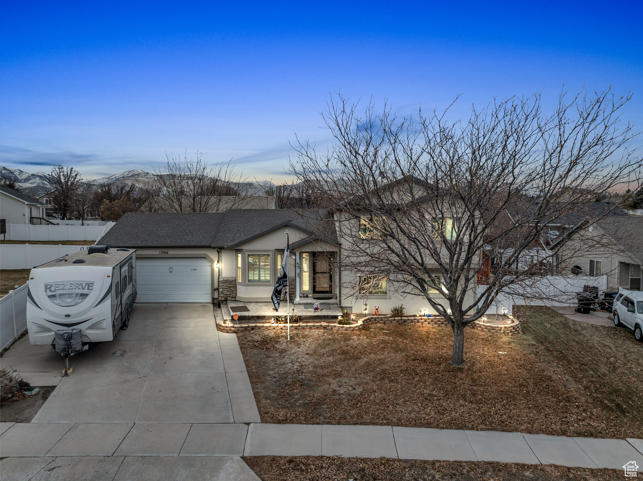 View of front of house featuring a garage and a mountain view