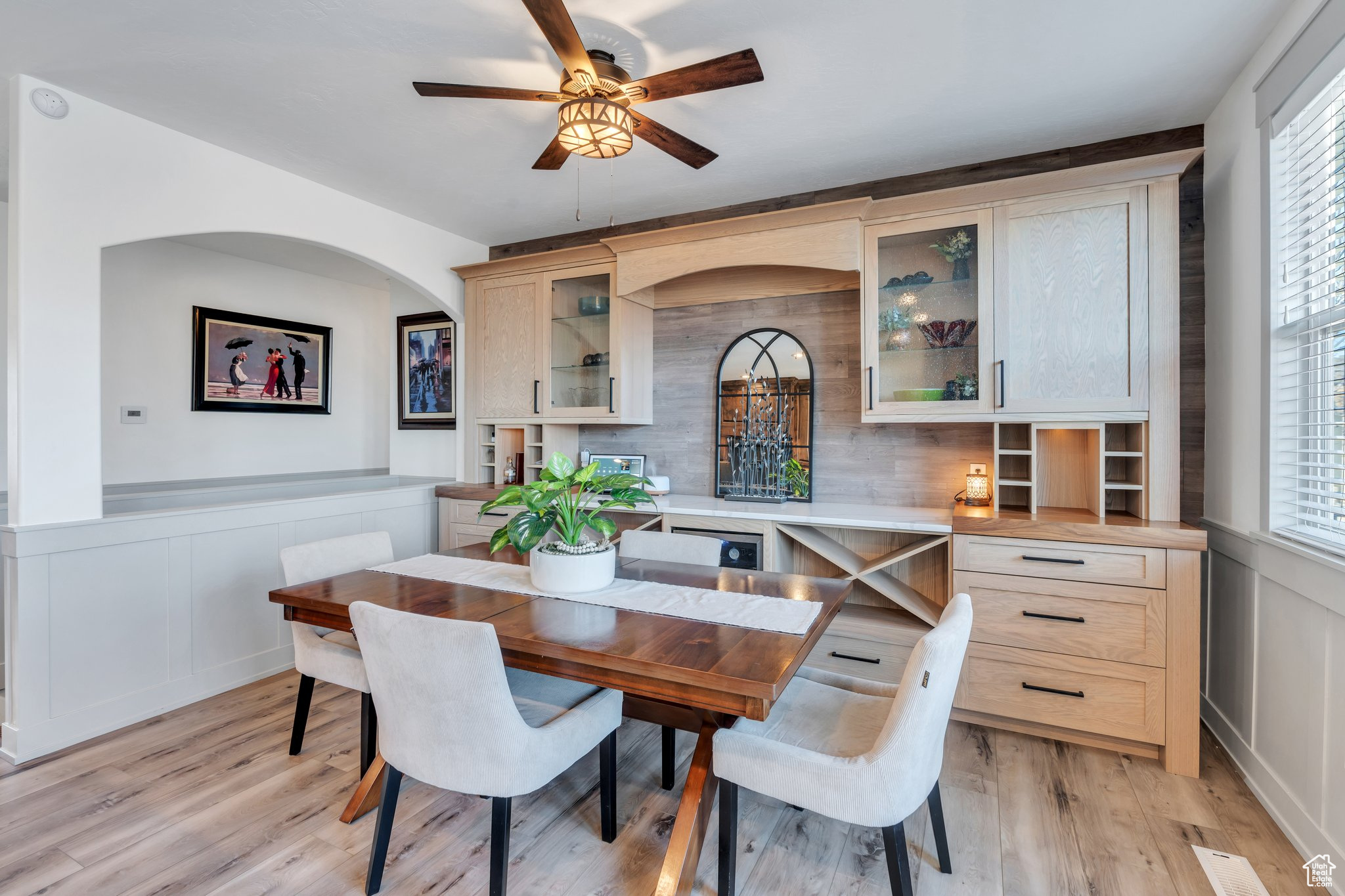 Dining area featuring ceiling fan, plenty of natural light, and light wood-type flooring