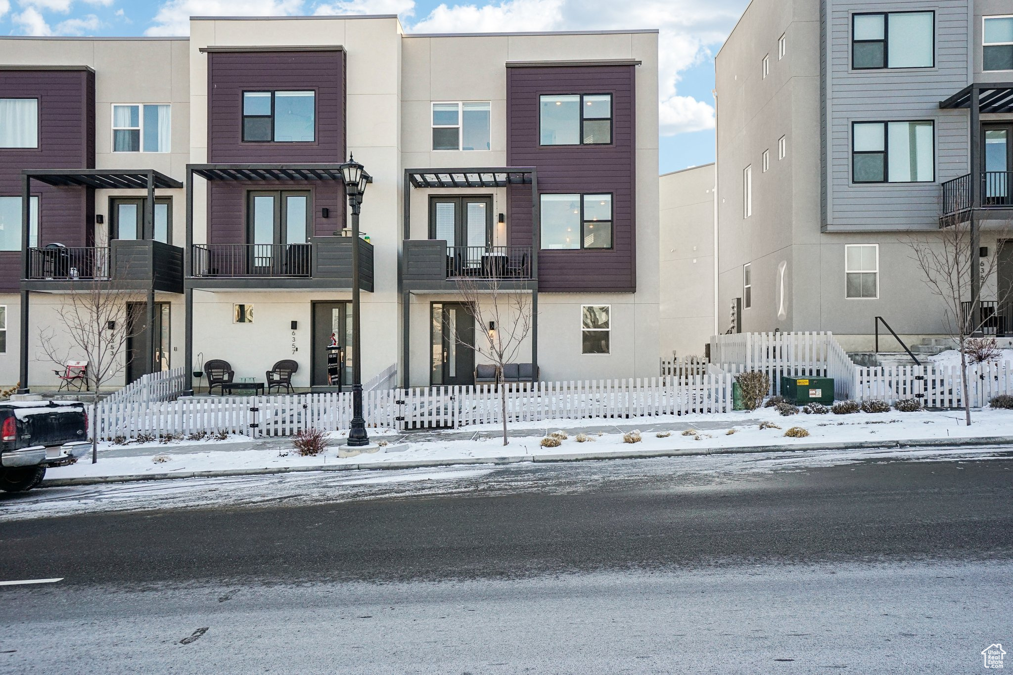 View of townhome from front. Unit for sale is the most right/end unit.