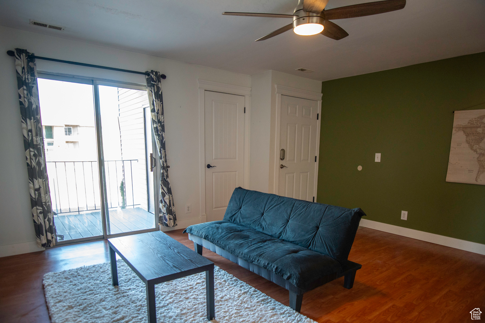 Living room with LVP flooring and ceiling fan