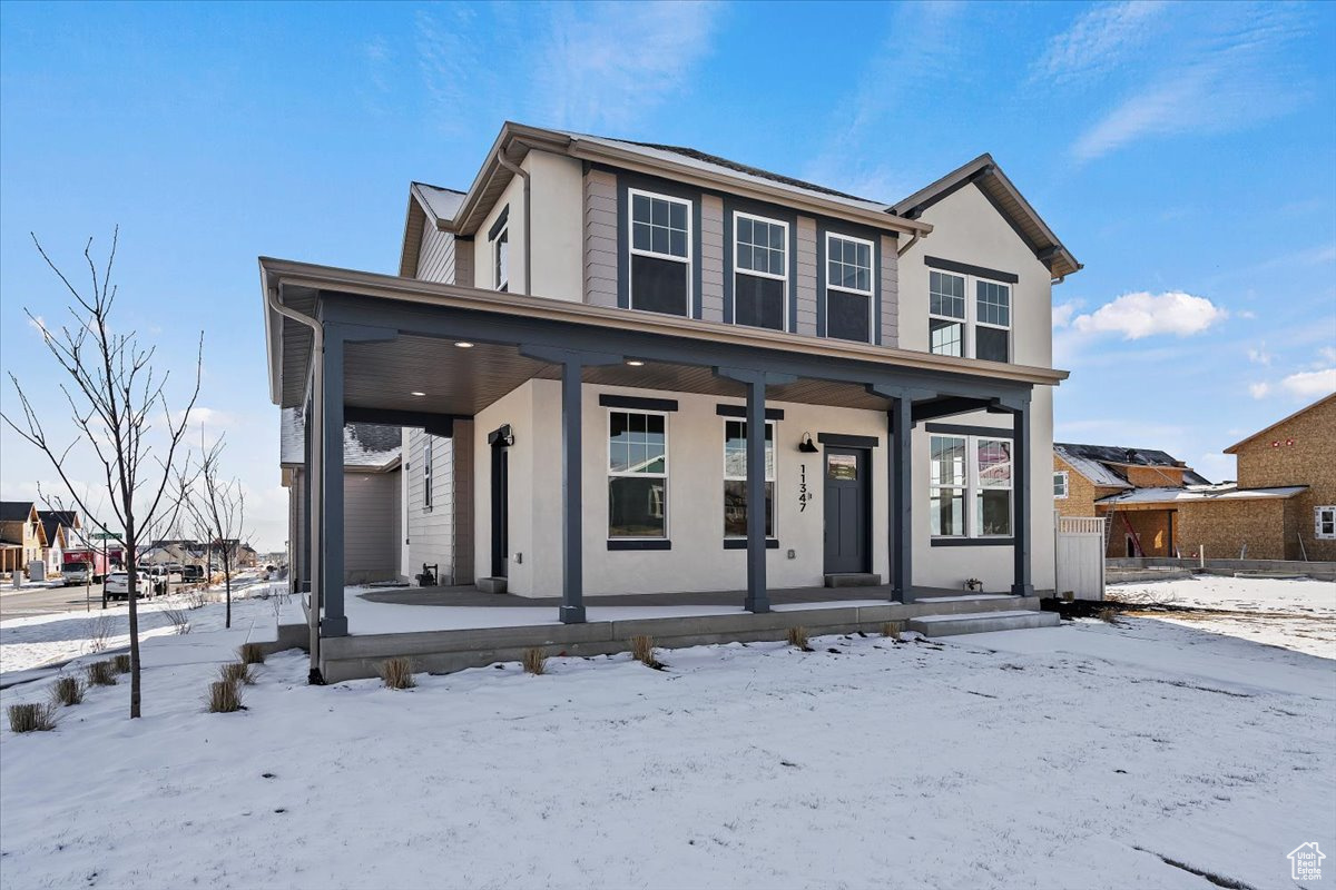 View of front of house featuring covered porch