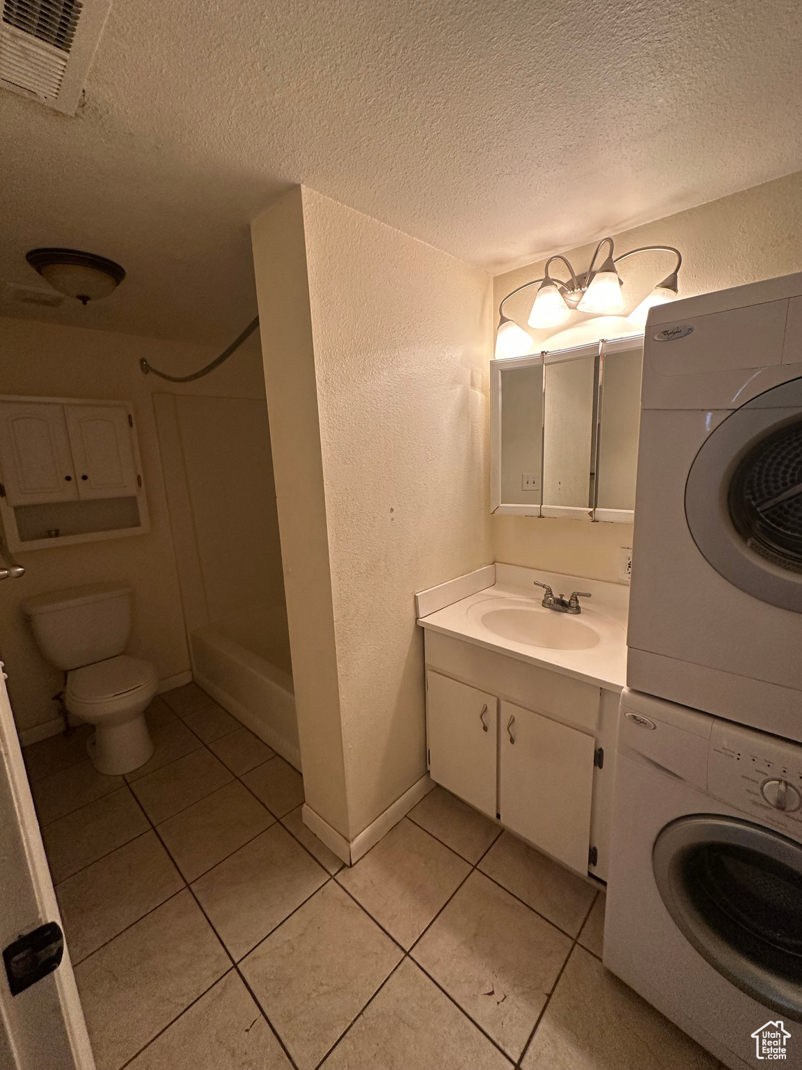 Full Bathroom with stackable Laundry