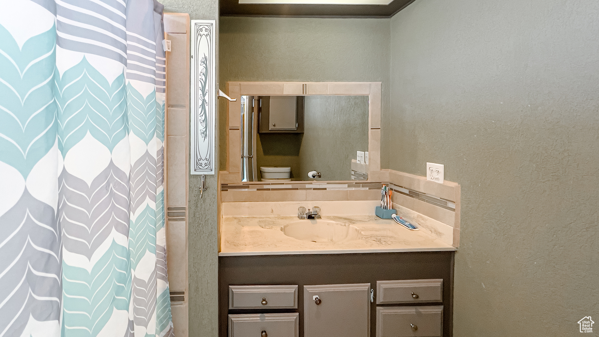 Bathroom with vanity and toilet