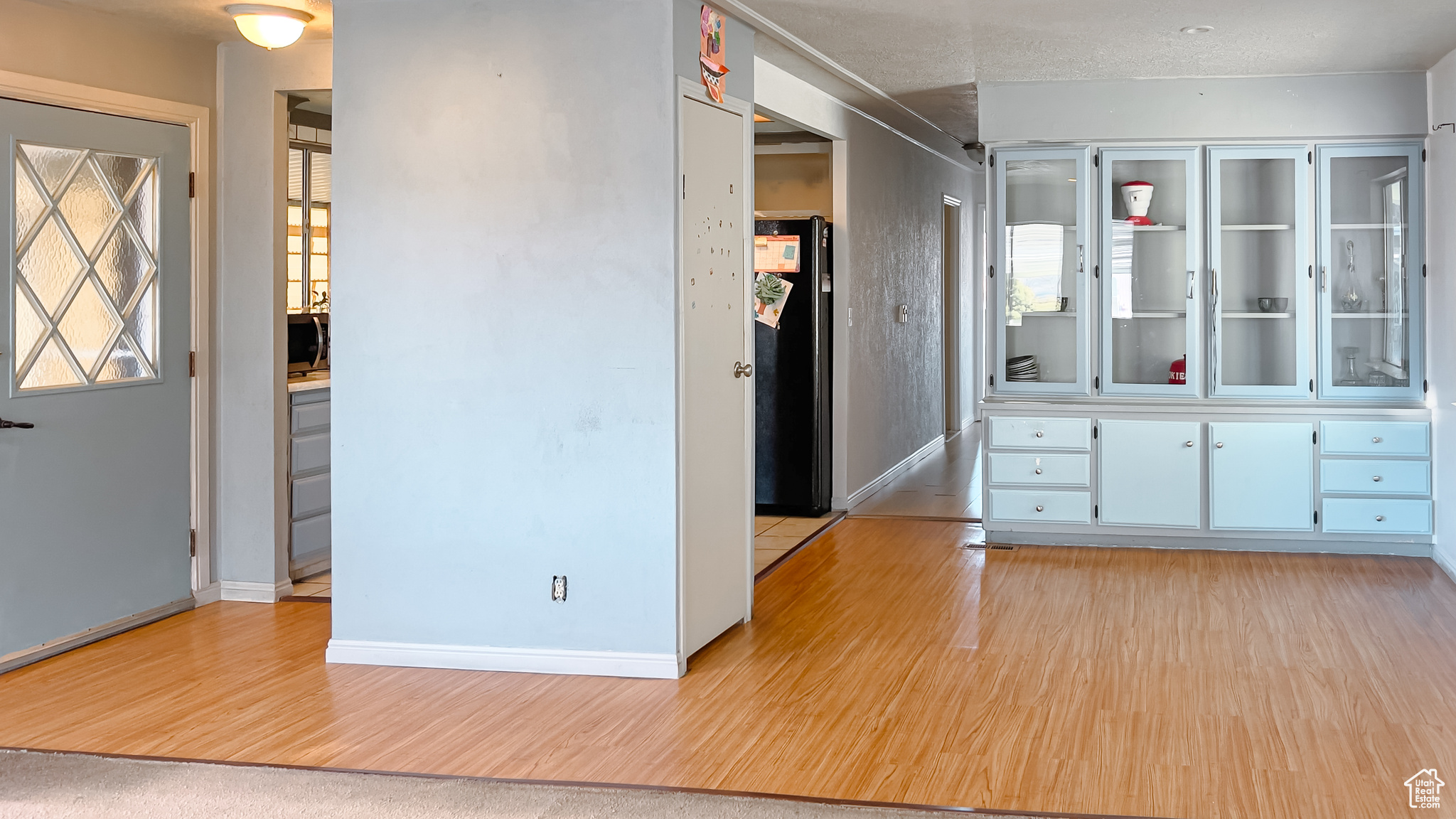 Corridor with light wood-type flooring