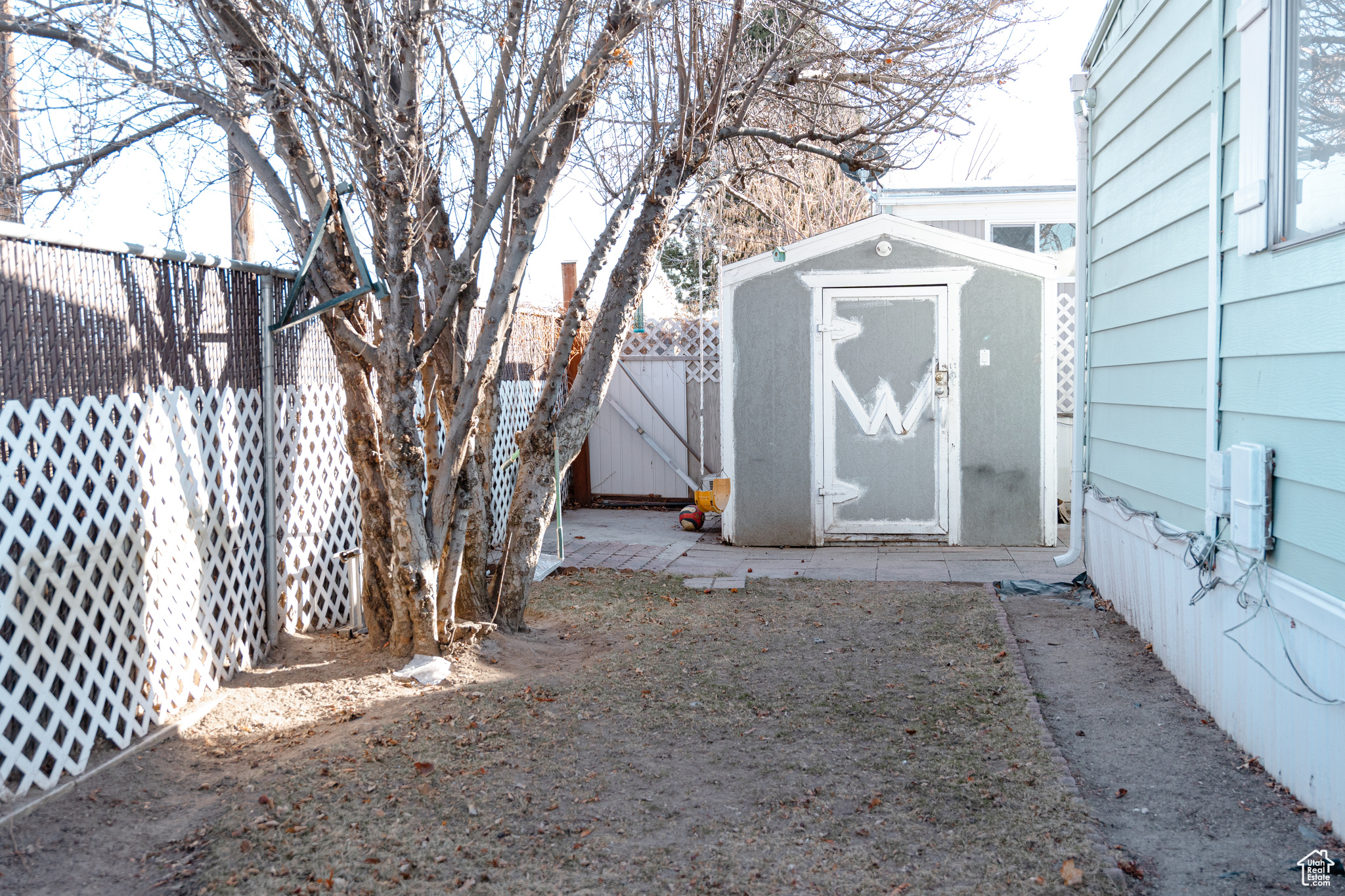 View of yard with a storage shed