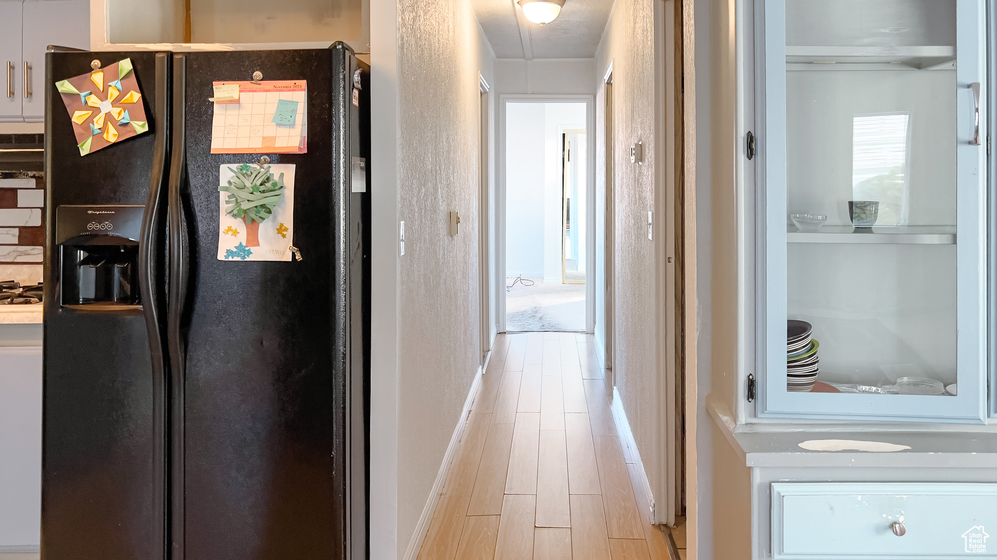 Hallway featuring light wood-type flooring