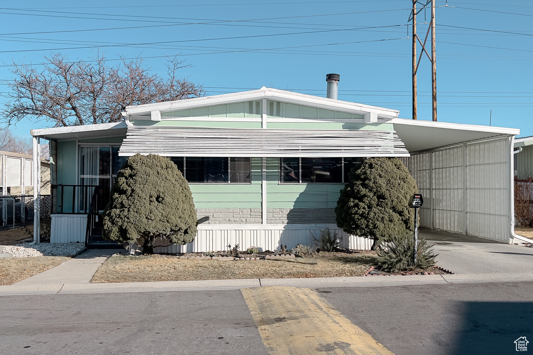 View of front of home featuring a carport