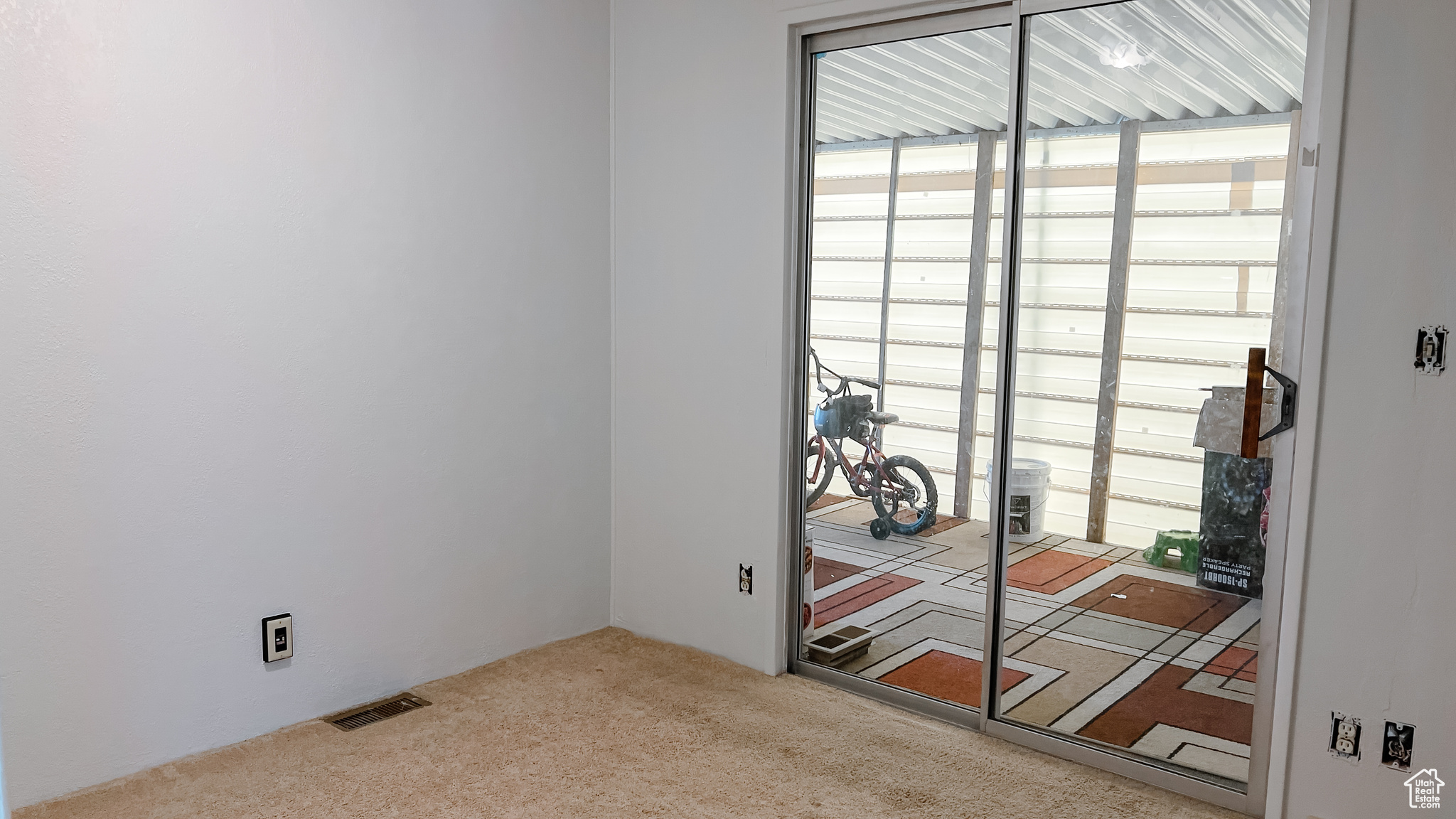 View of carpeted spare room