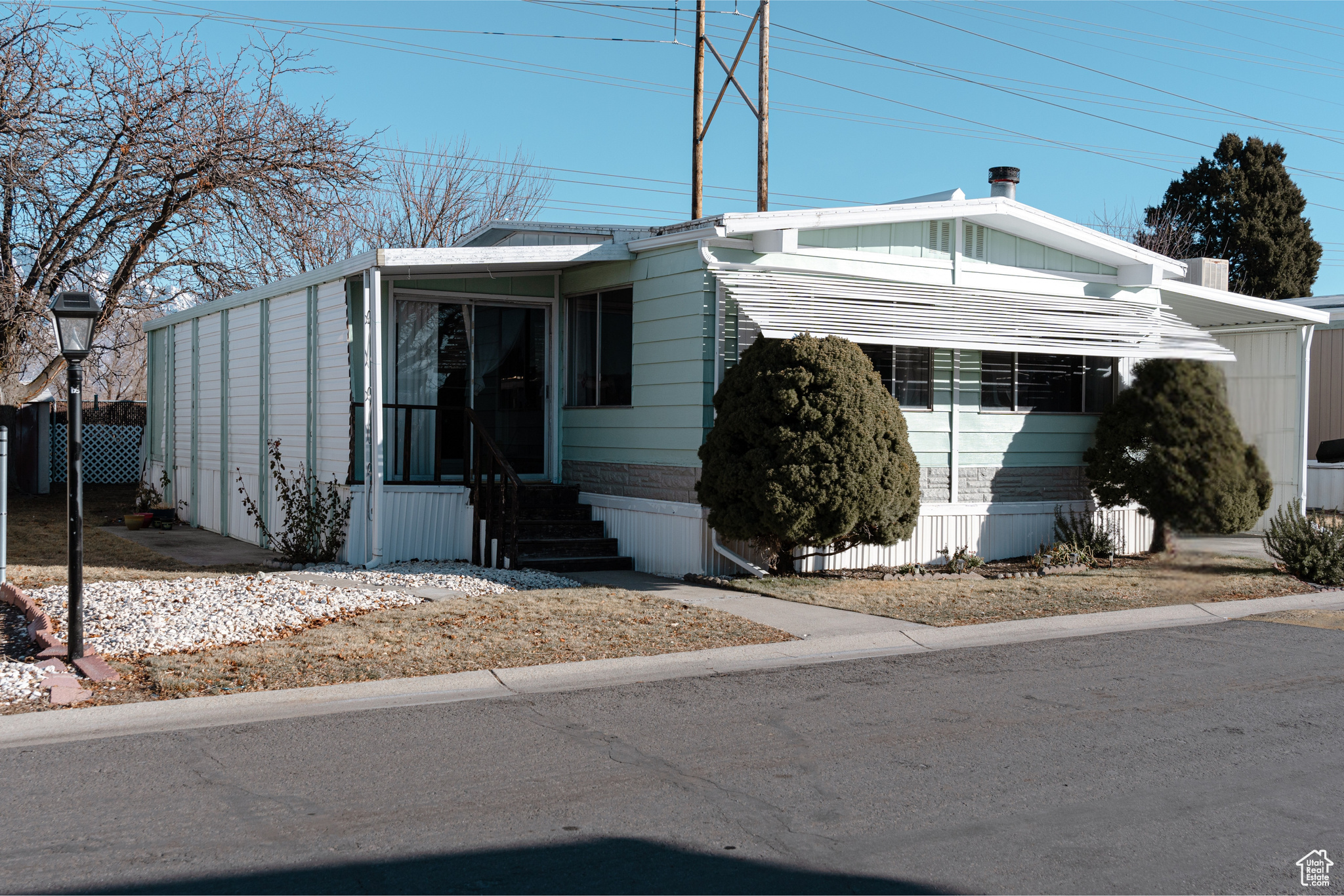 View of front of house with a carport