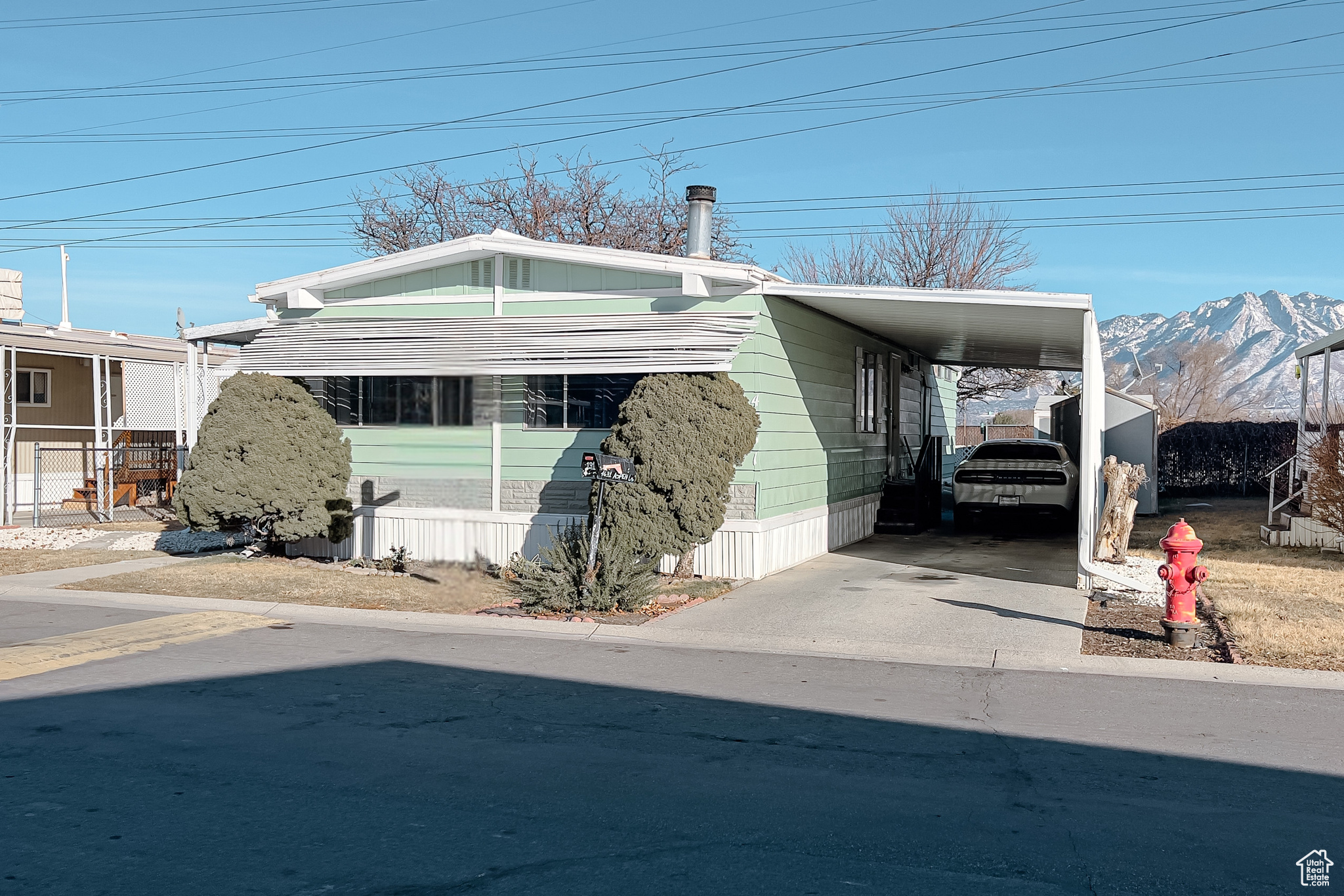 Exterior space featuring a mountain view and a carport