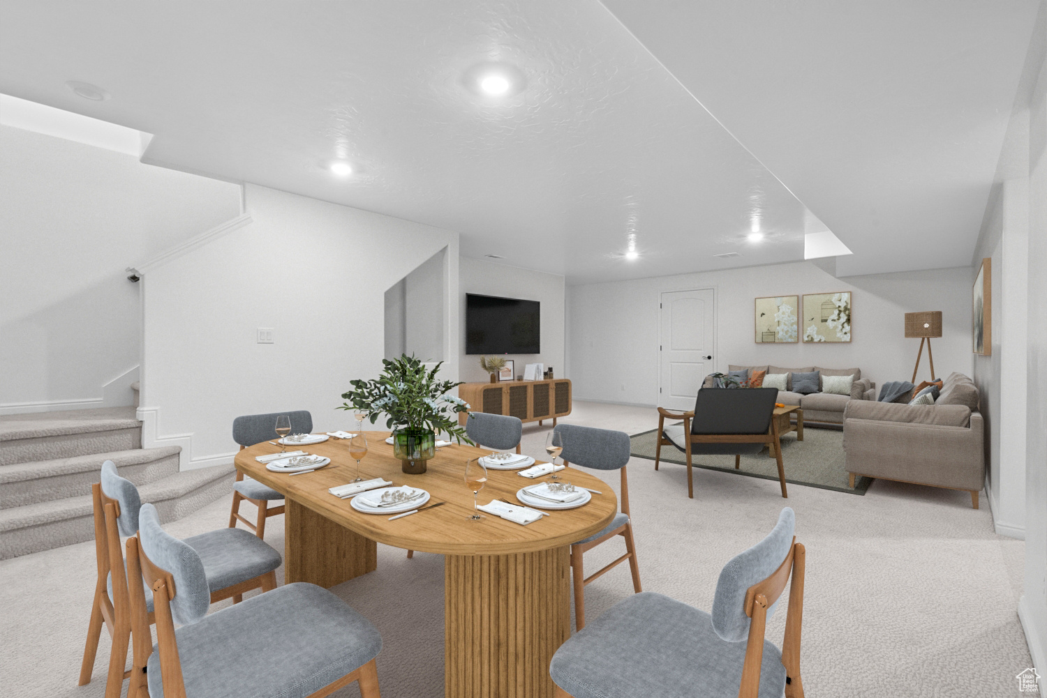 Dining area featuring light colored carpet