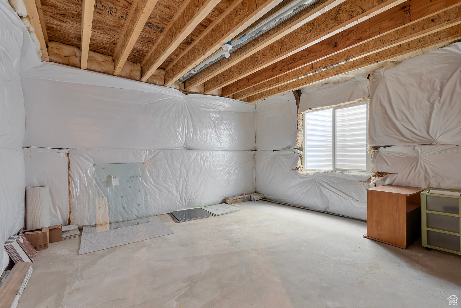 Unfinished basement bedroom