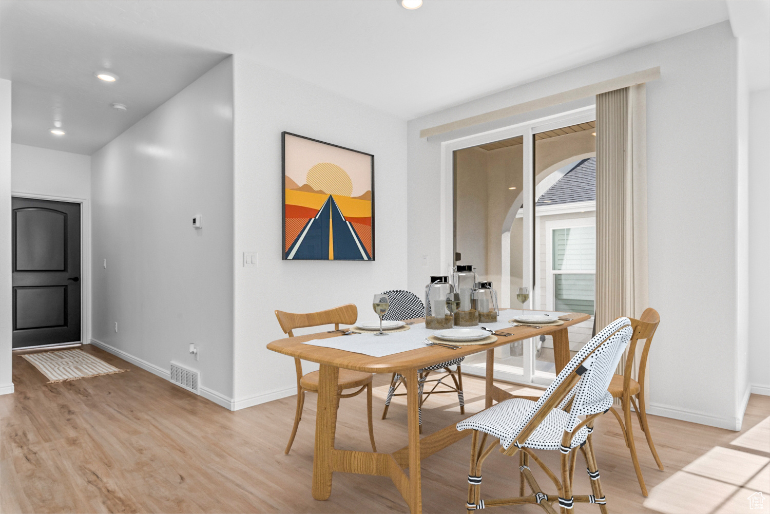 Dining space featuring light hardwood / wood-style flooring