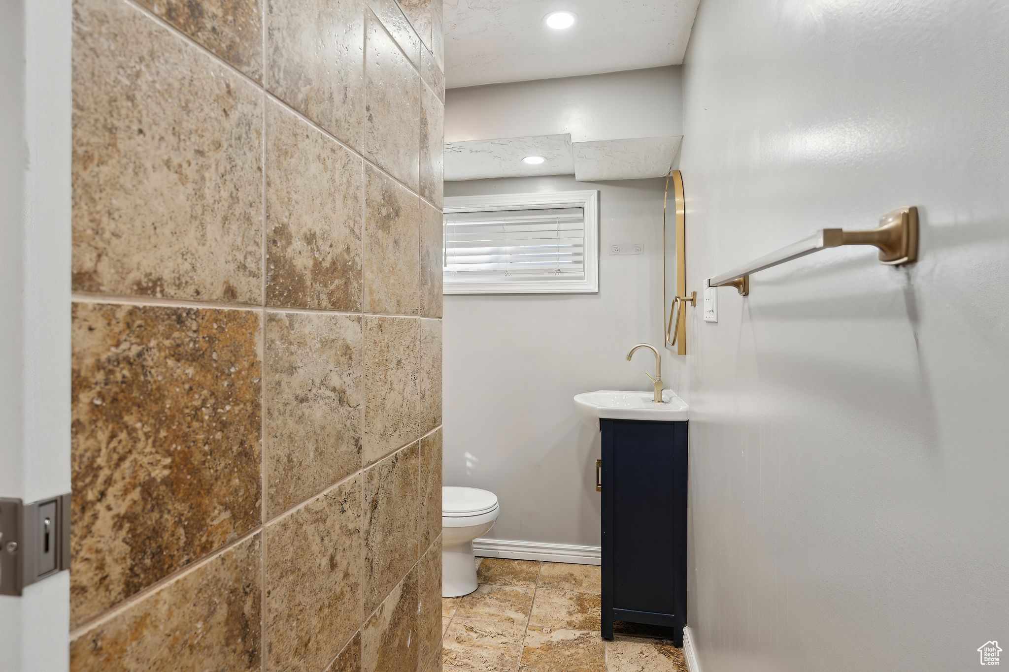 Bathroom with vanity and toilet