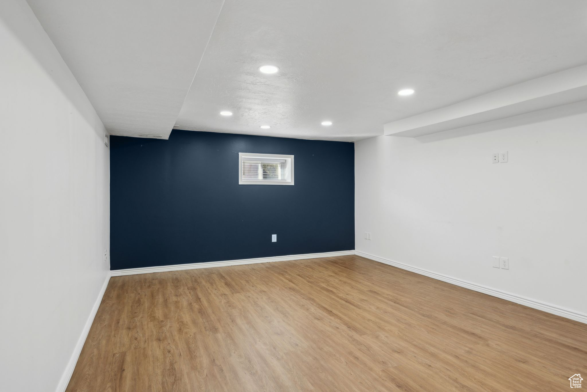 Empty room featuring hardwood / wood-style flooring