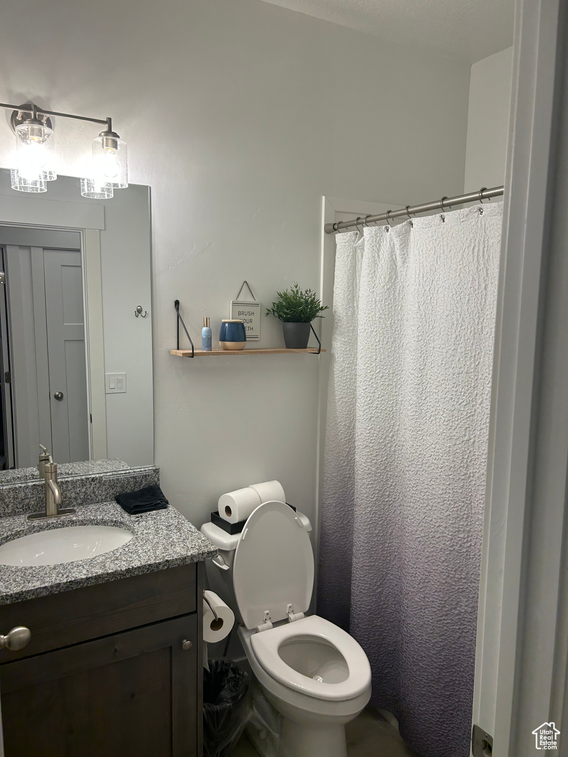 Bathroom with vanity and toilet