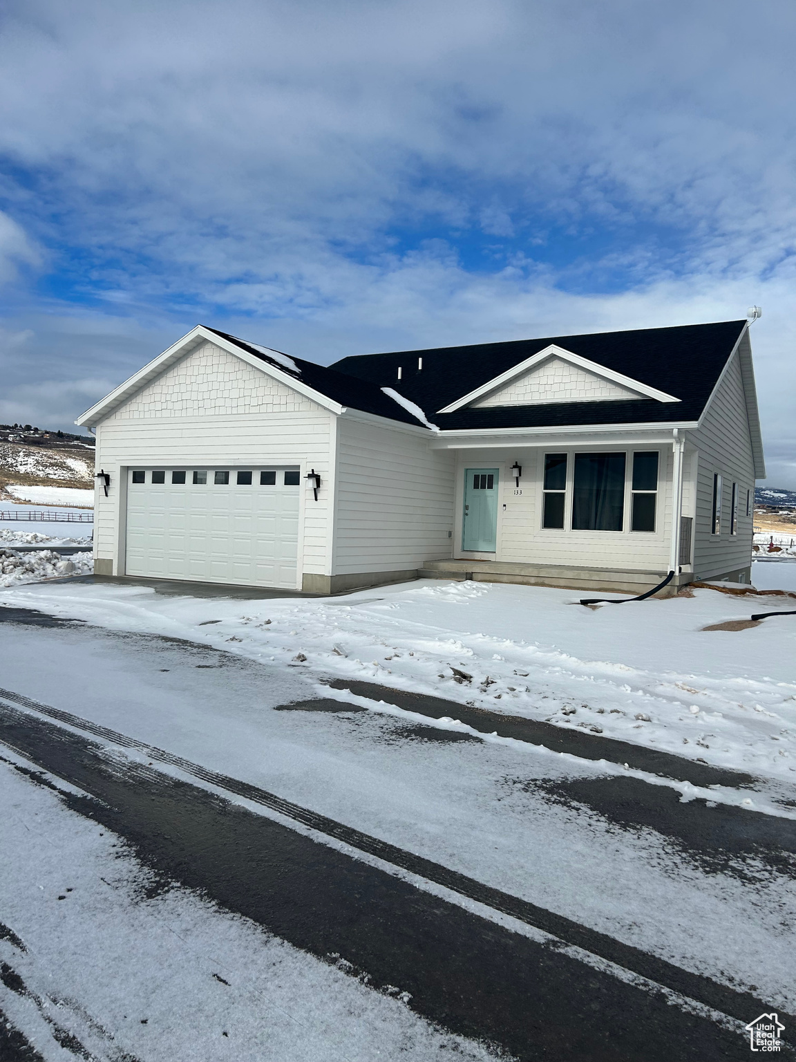 View of front of home featuring a garage