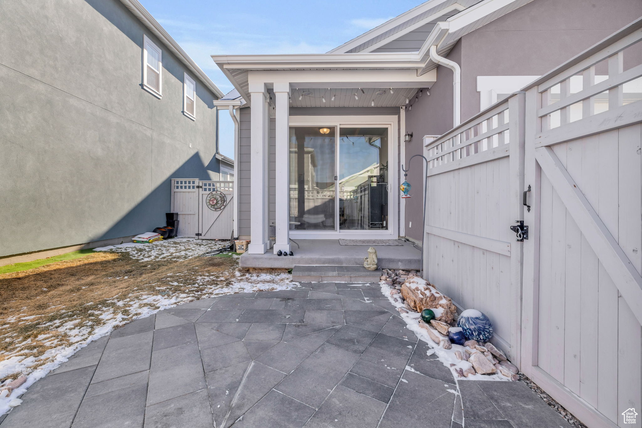 Glass sliders to primary suite from private patio.