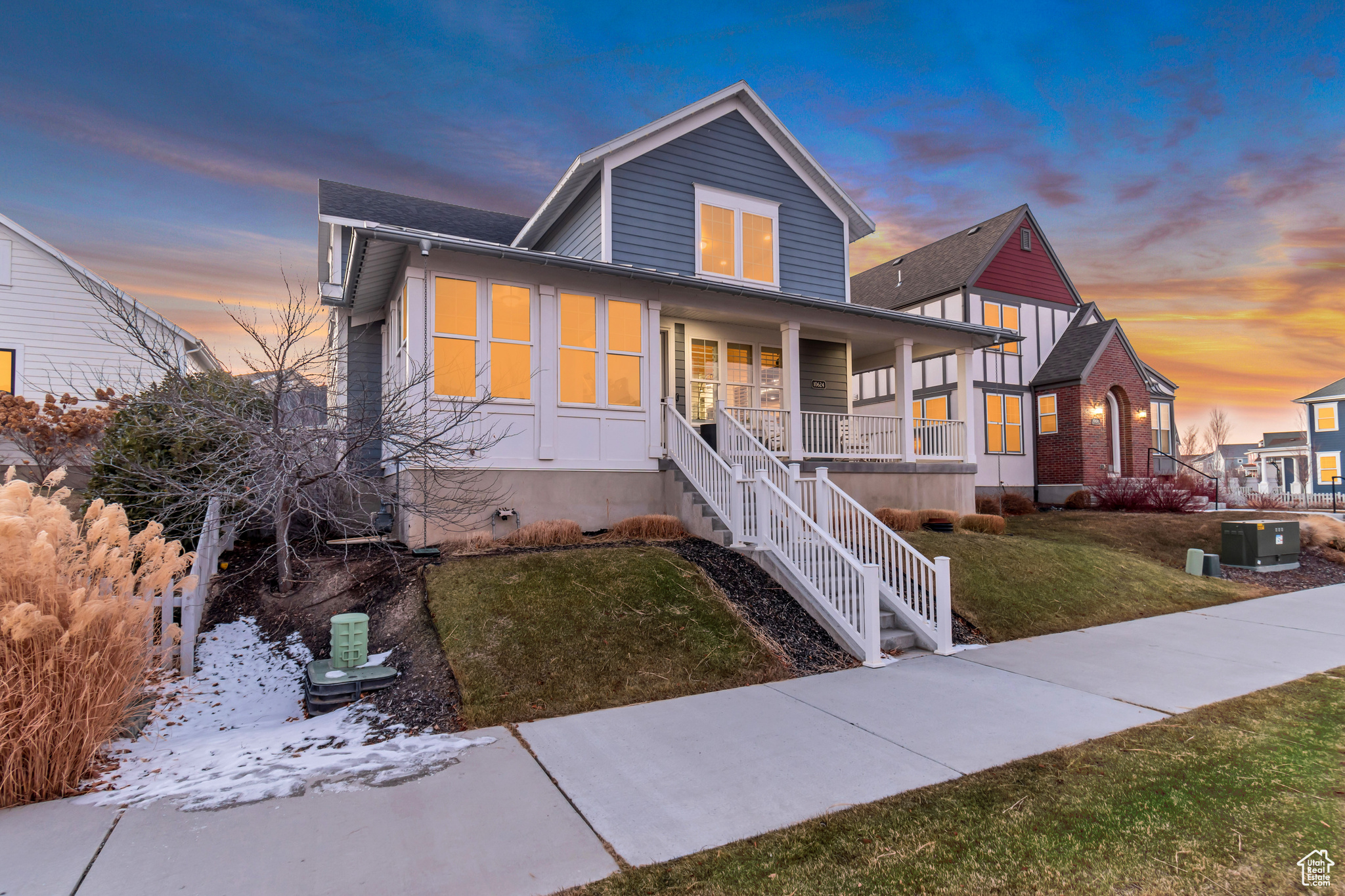 View of front of house featuring a porch, a yard, and central AC unit