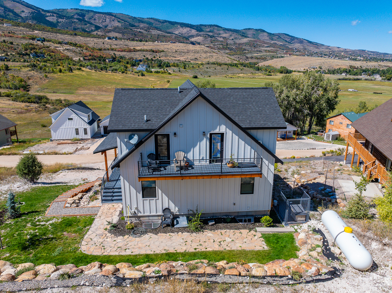 Rear view of house featuring a mountain view