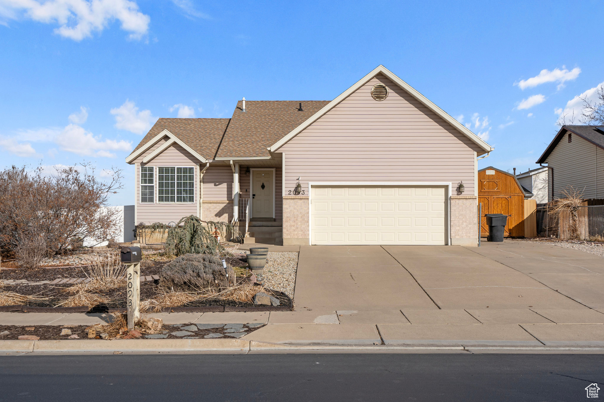 Ranch-style house featuring a garage