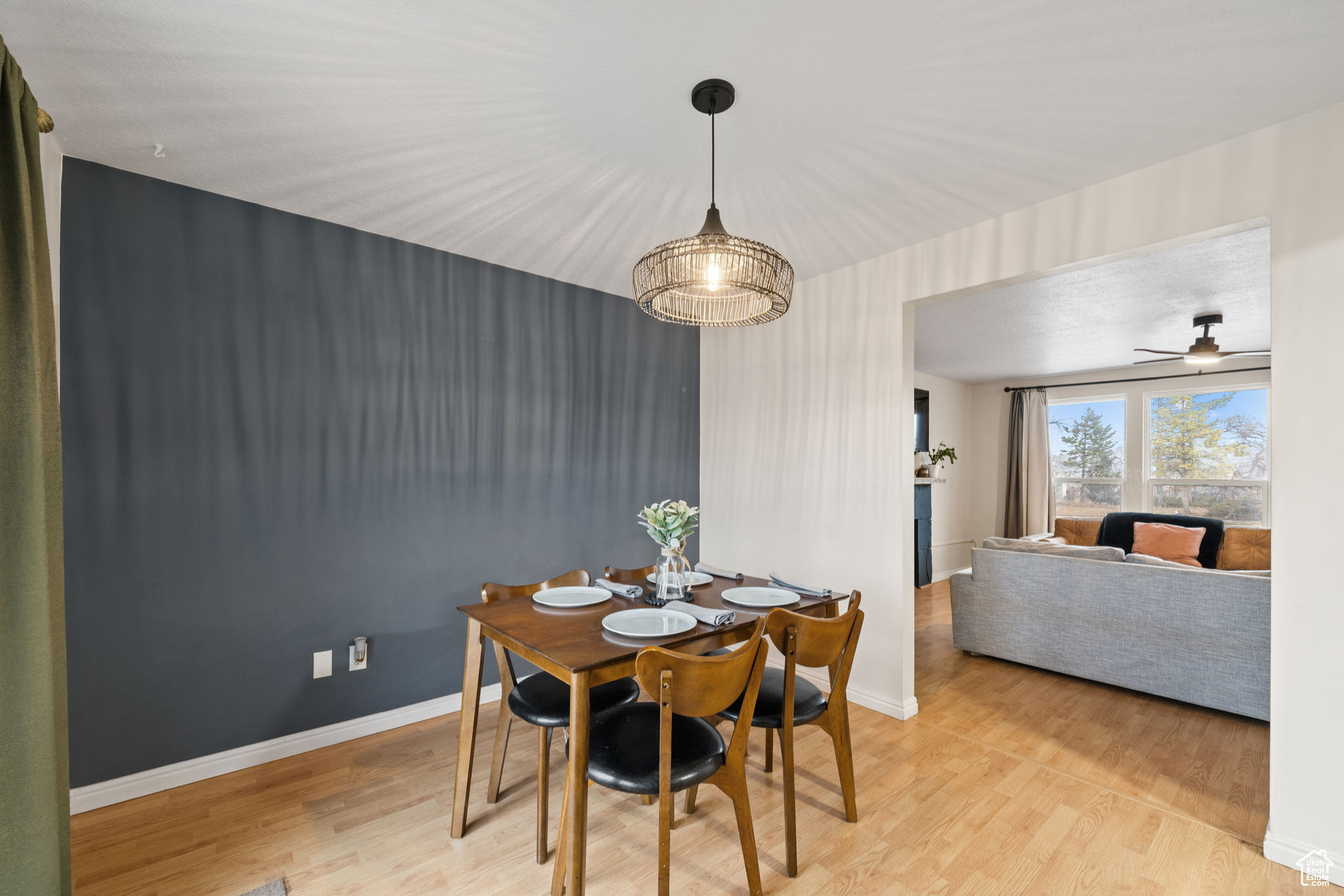 Dining space with light hardwood / wood-style flooring