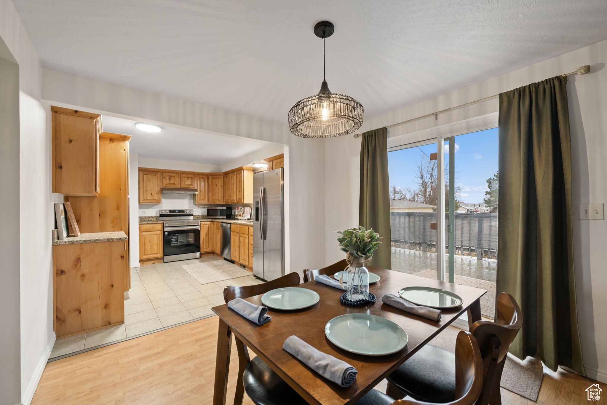 Dining room with light hardwood / wood-style floors