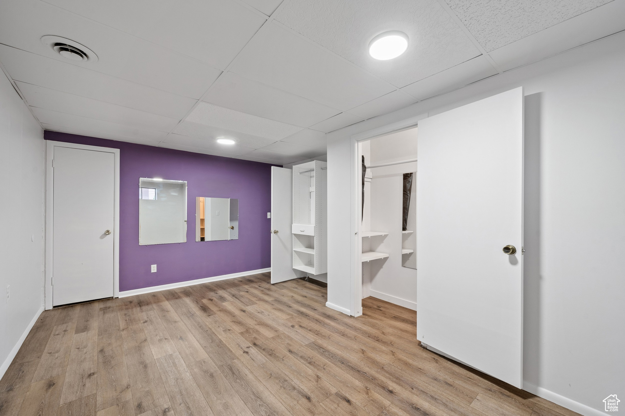 Basement bedroom with walk in closet.