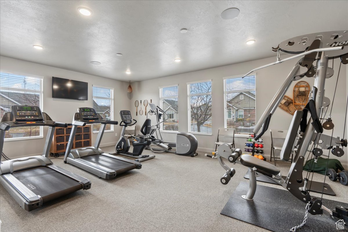 Workout area featuring a textured ceiling