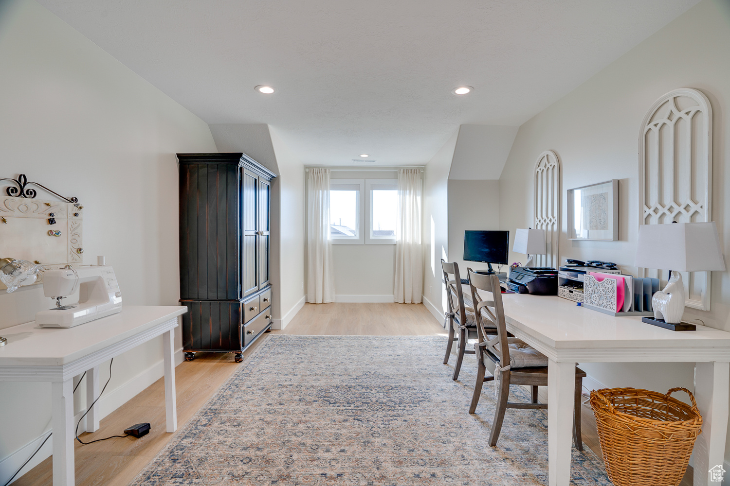 Home office featuring light hardwood / wood-style floors