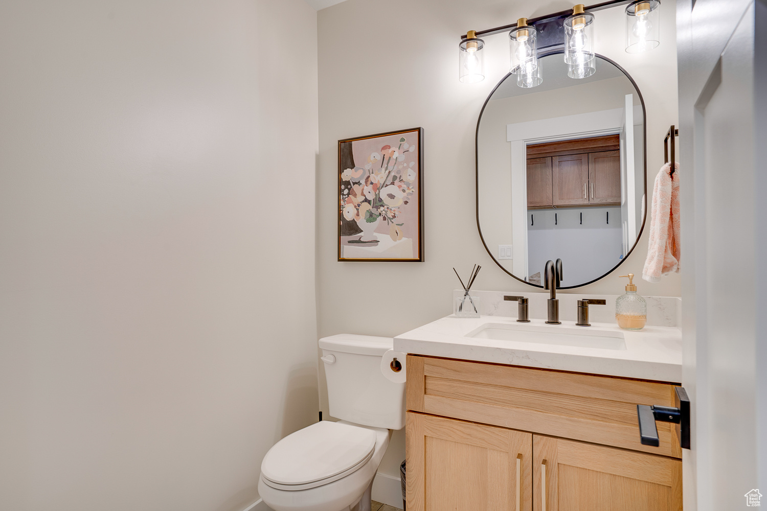 Bathroom featuring vanity and toilet