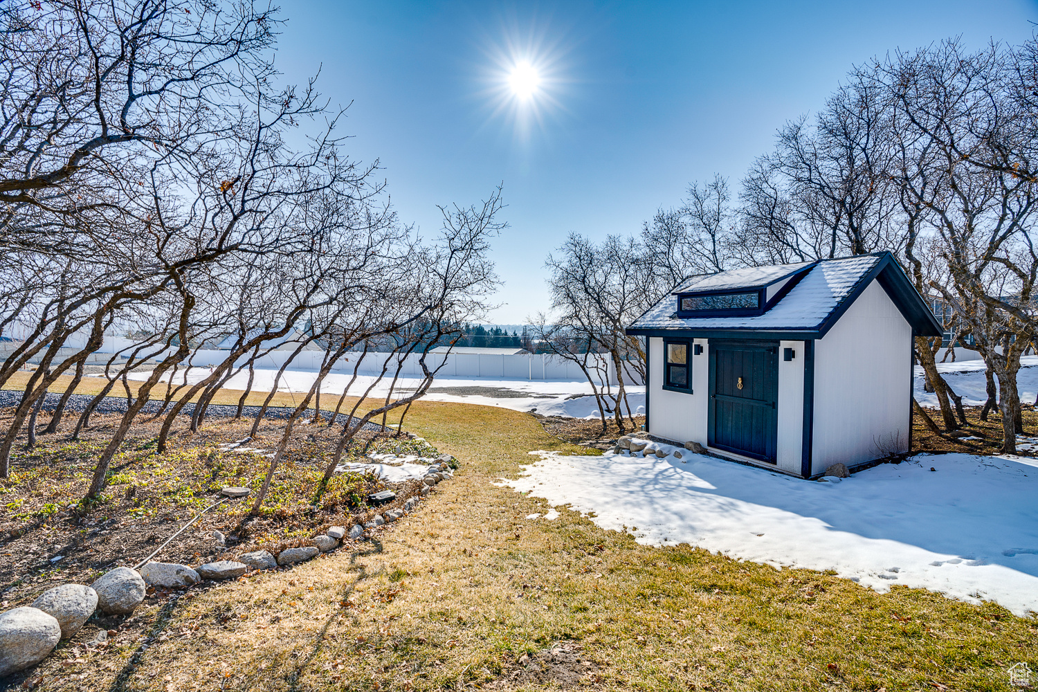 View of yard with a storage shed