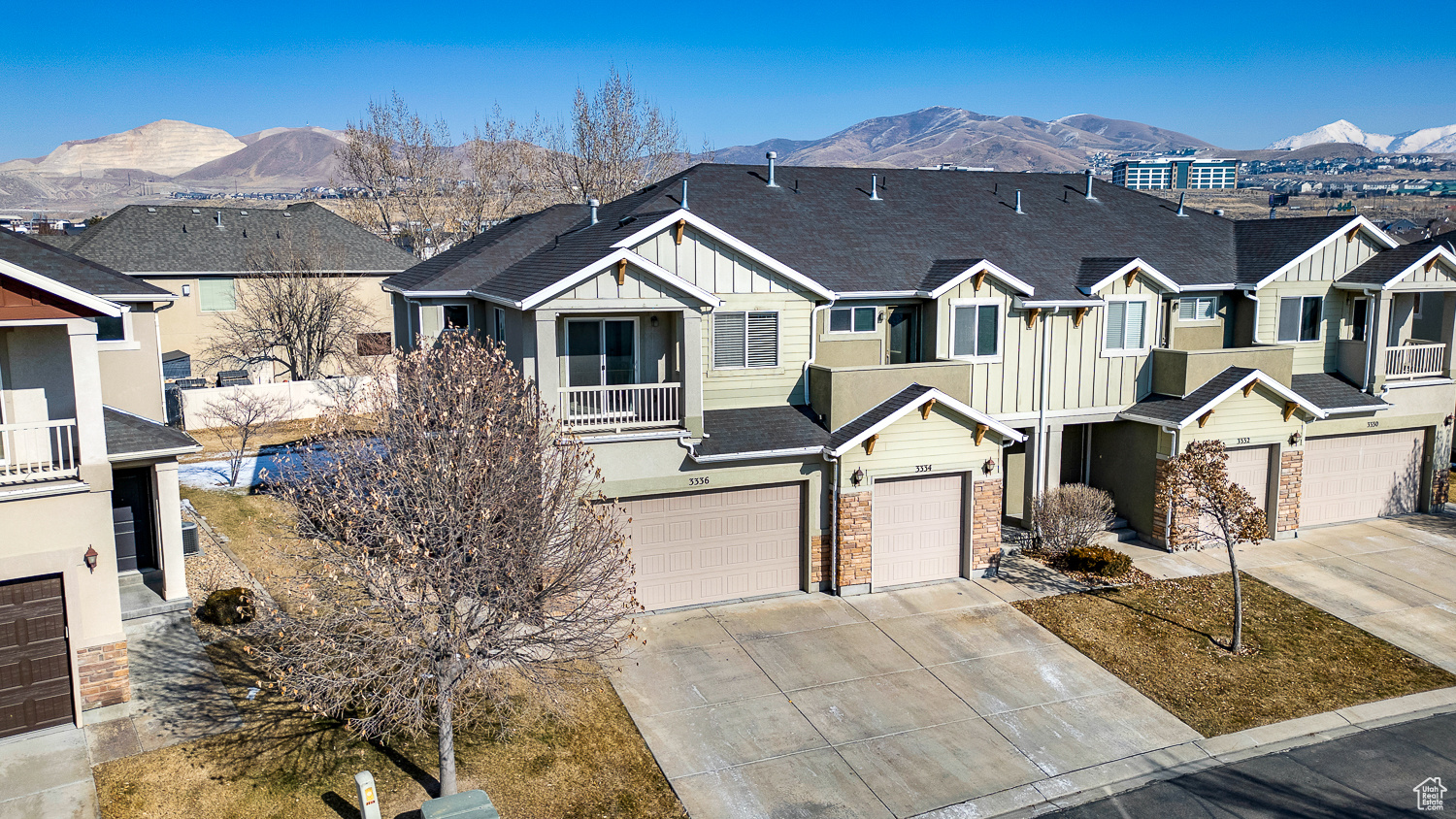 View of front of house with a mountain view and a balcony