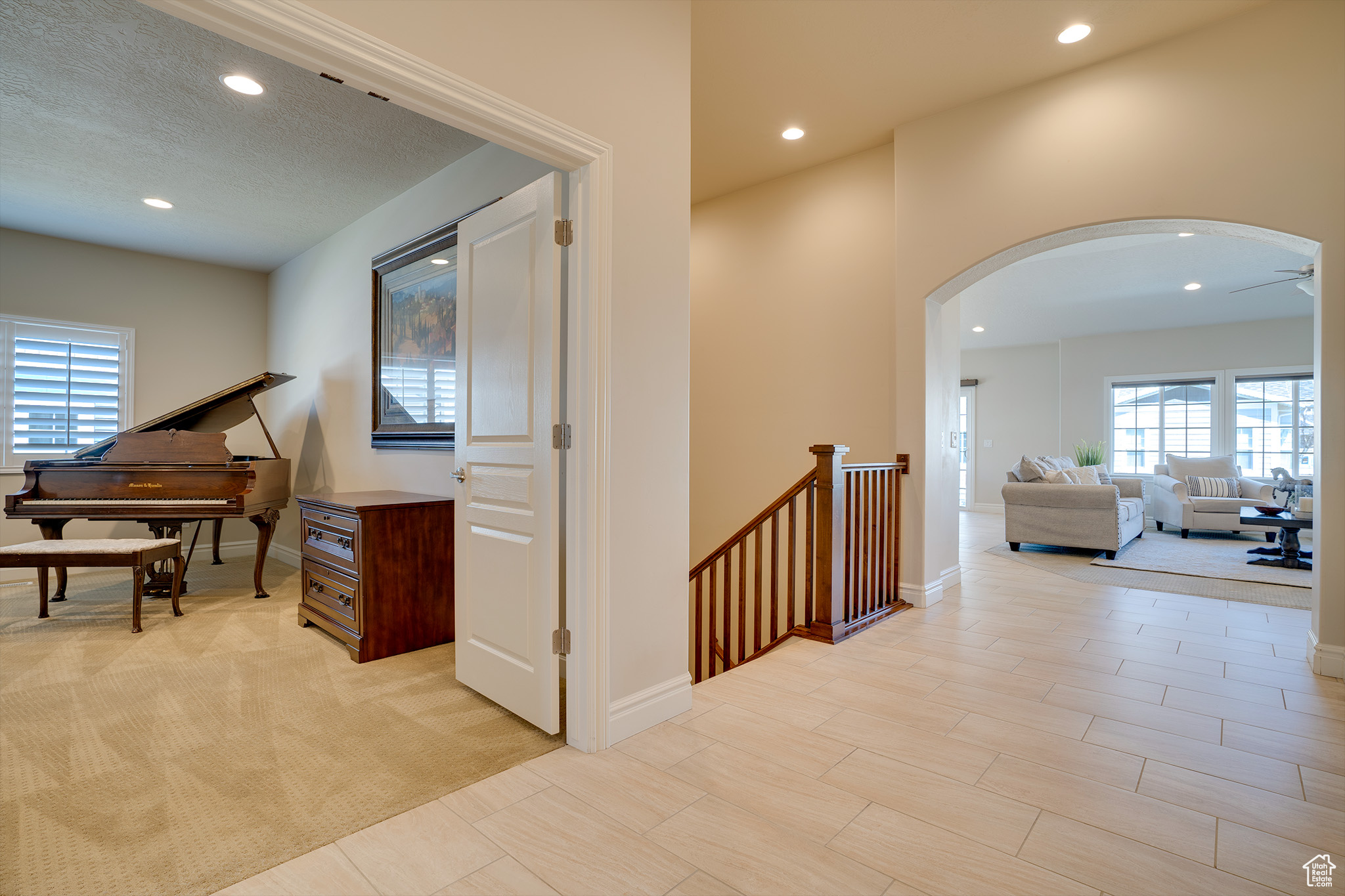 Hallway with plenty of natural light and a textured ceiling