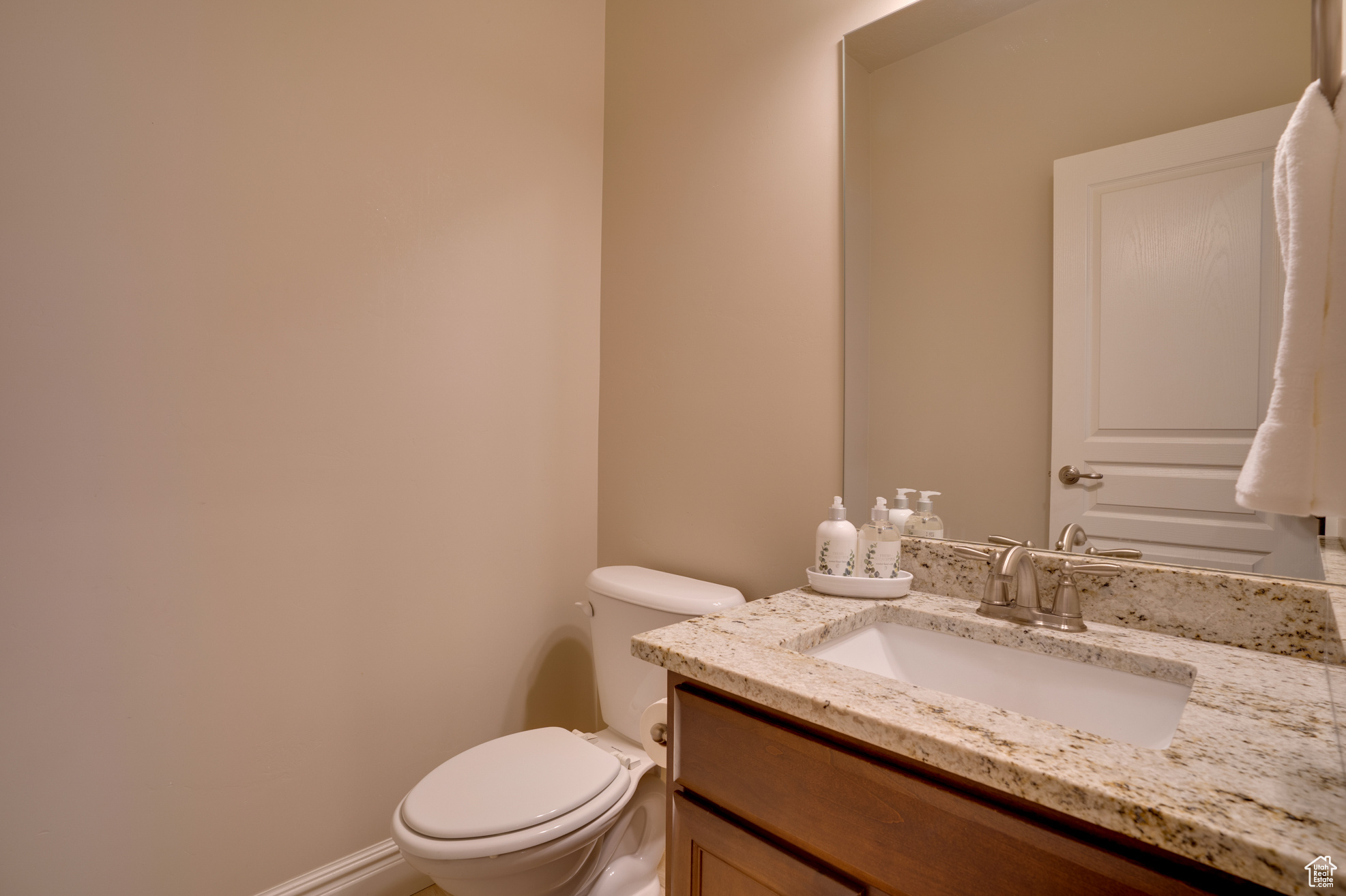 Bathroom with vanity and toilet