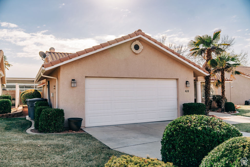 View of home's exterior with a garage