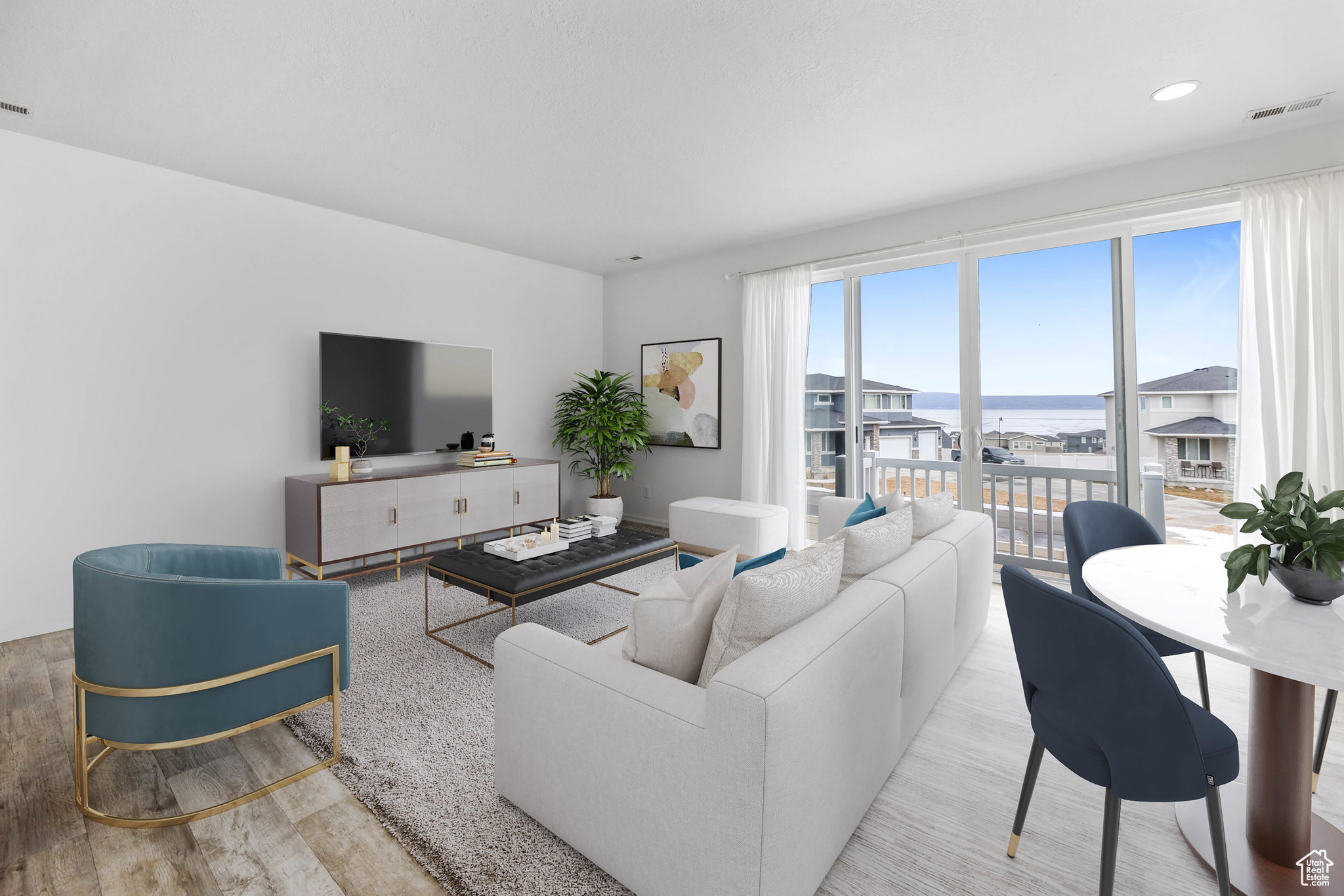 Living room with light hardwood / wood-style floors