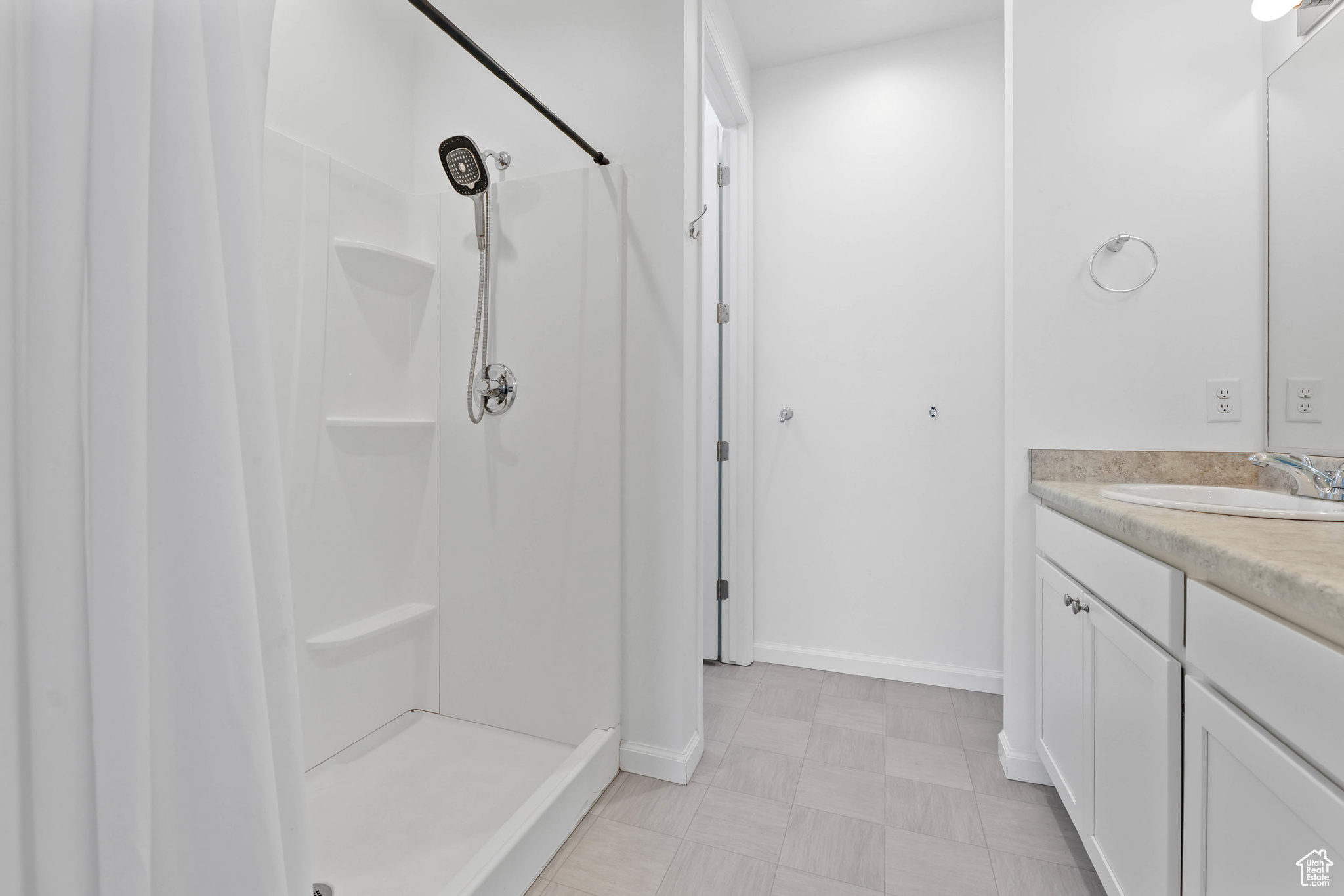 Bathroom featuring  double vanity and walk in shower located off the primary bedroom.