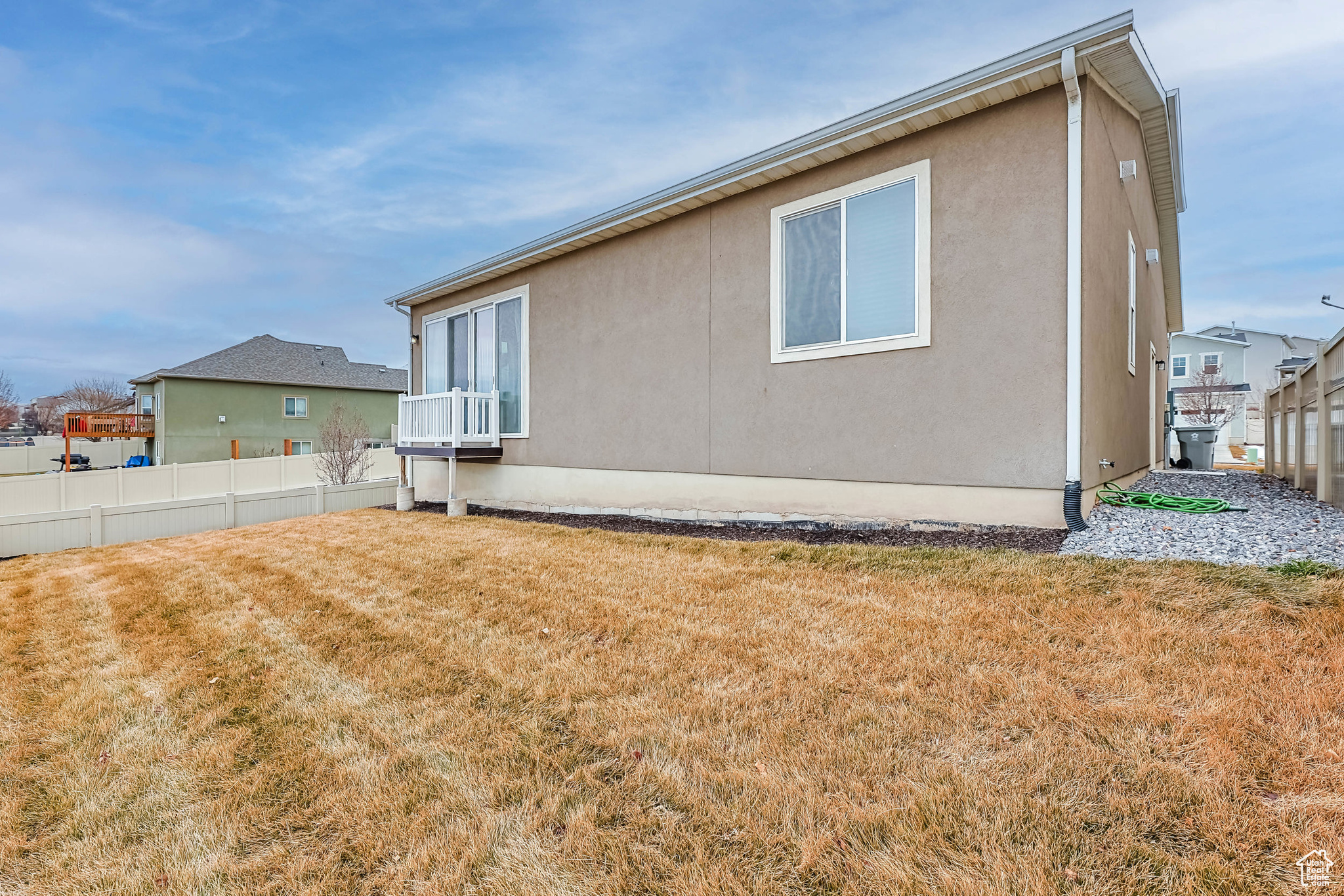 View of property exterior with a lawn