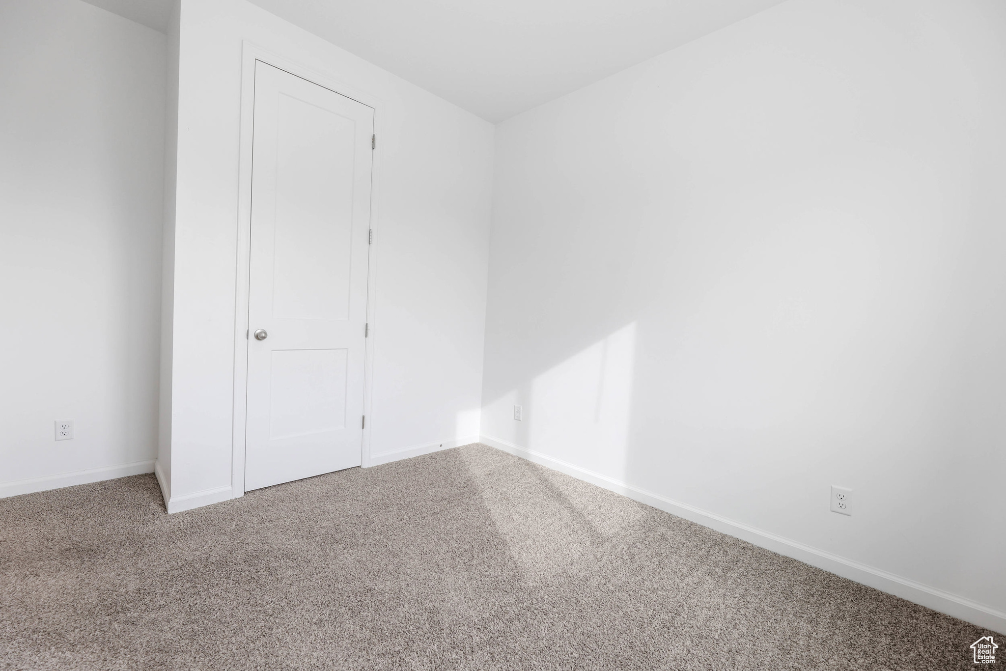 Unfurnished bedroom with carpet