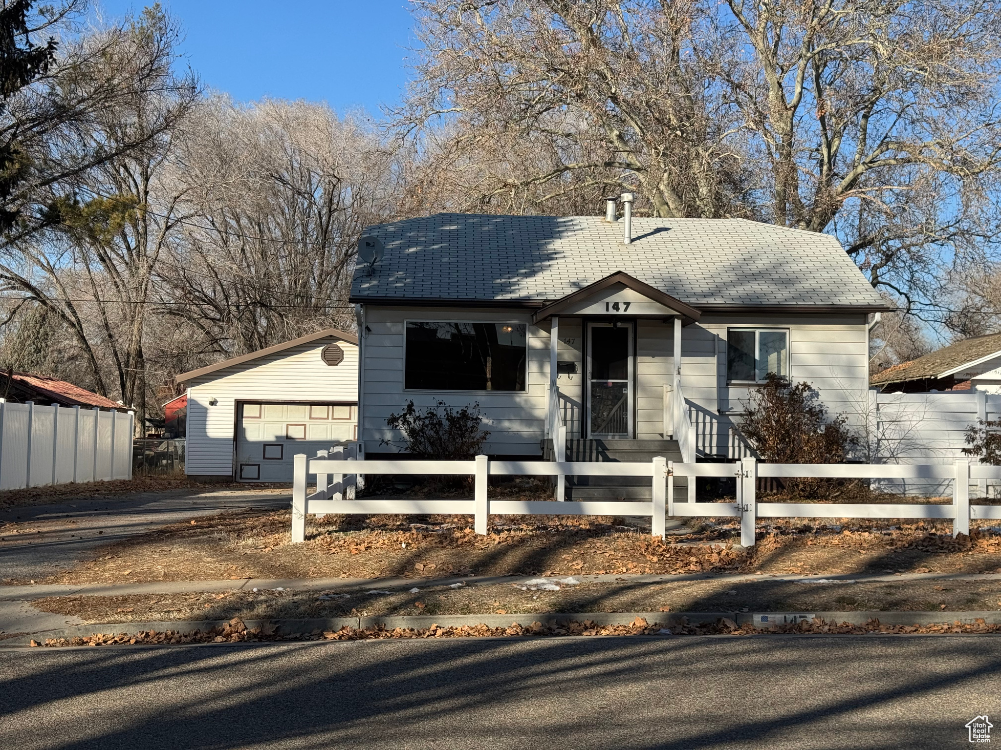 View of front facade featuring a garage