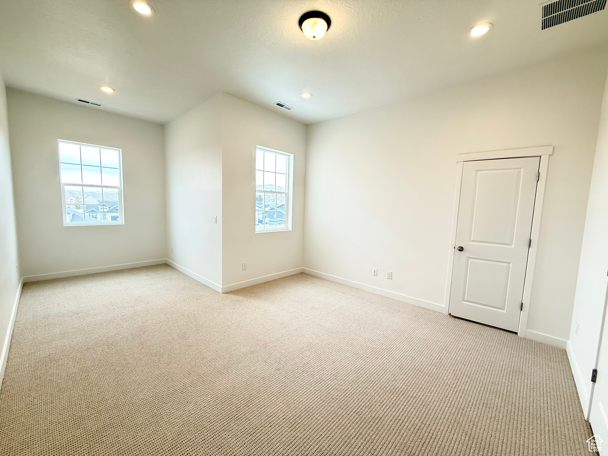 View of carpeted spare room