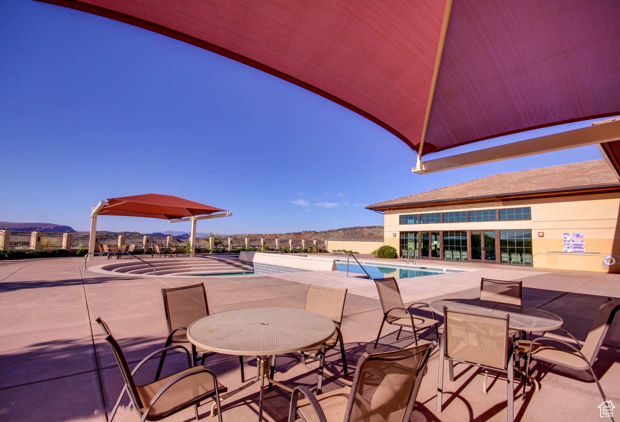 Exterior community space with a patio