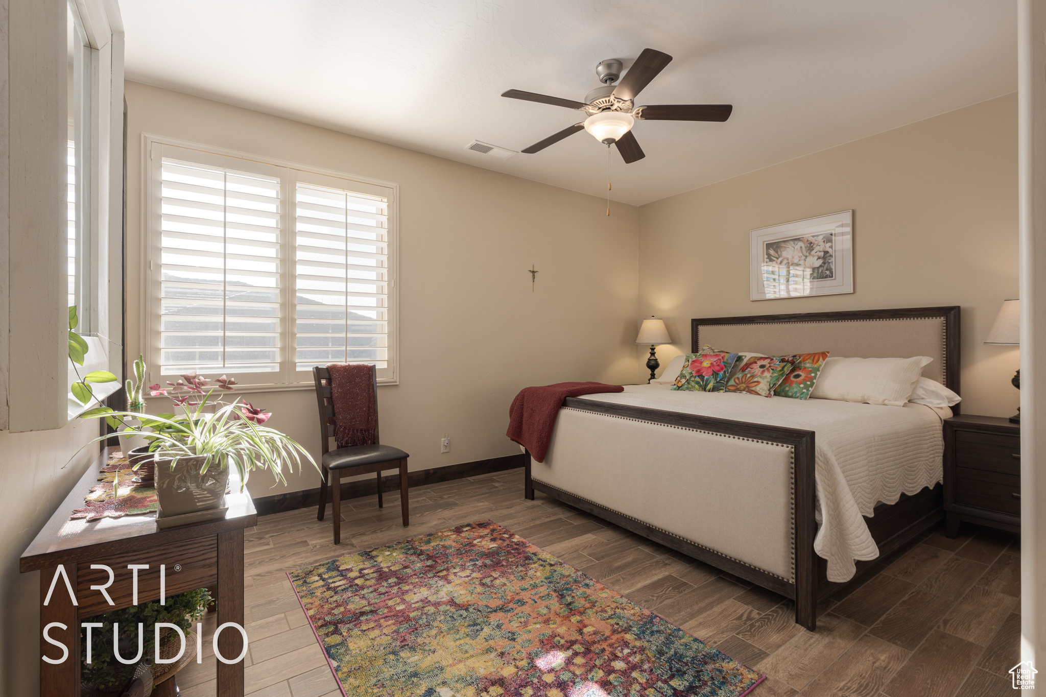 Bedroom 2 with wood look tile flooring and ceiling fan