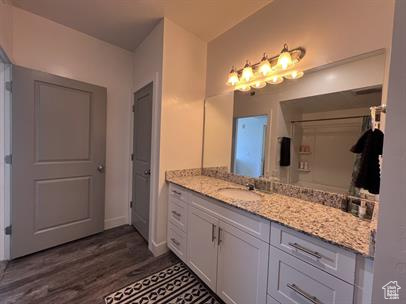 Bathroom with vanity and hardwood / wood-style floors