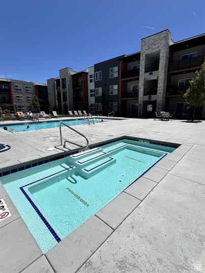 View of swimming pool featuring a patio area